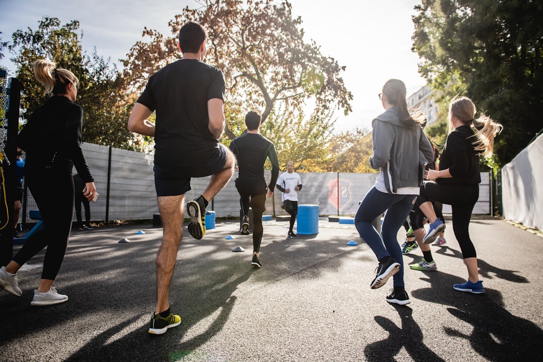 journey man-in-black-t-shirt-and-black-shorts-running-on-road-during-daytime-j154nekpzlq